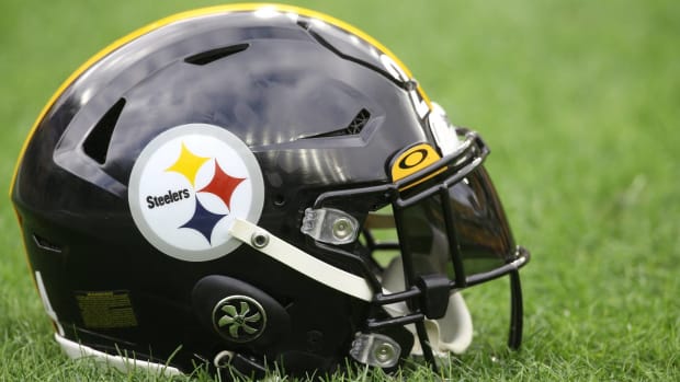 A Pittsburgh Steelers helmet sits on the field before a game.